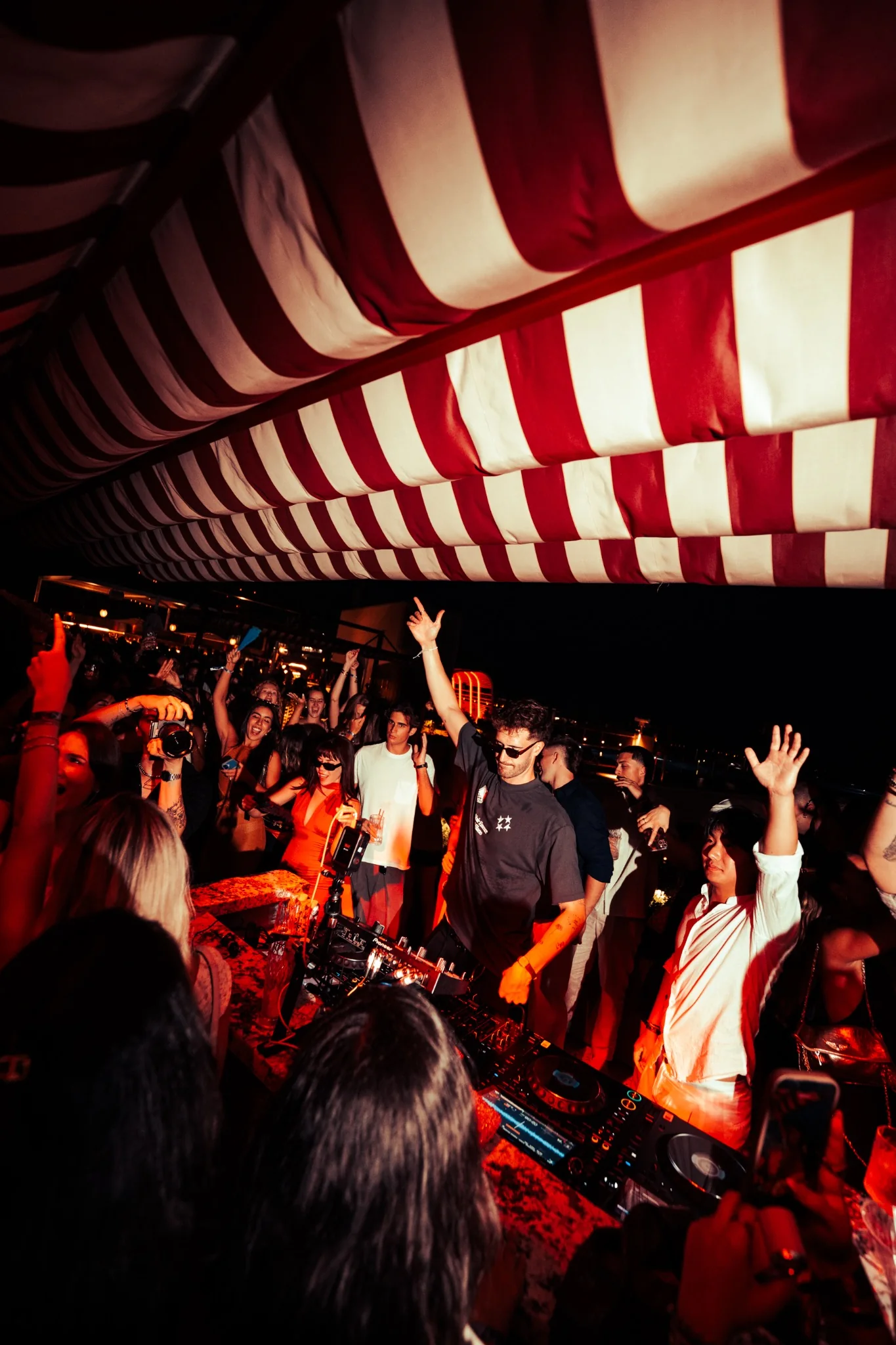LXBE performing behind the decks