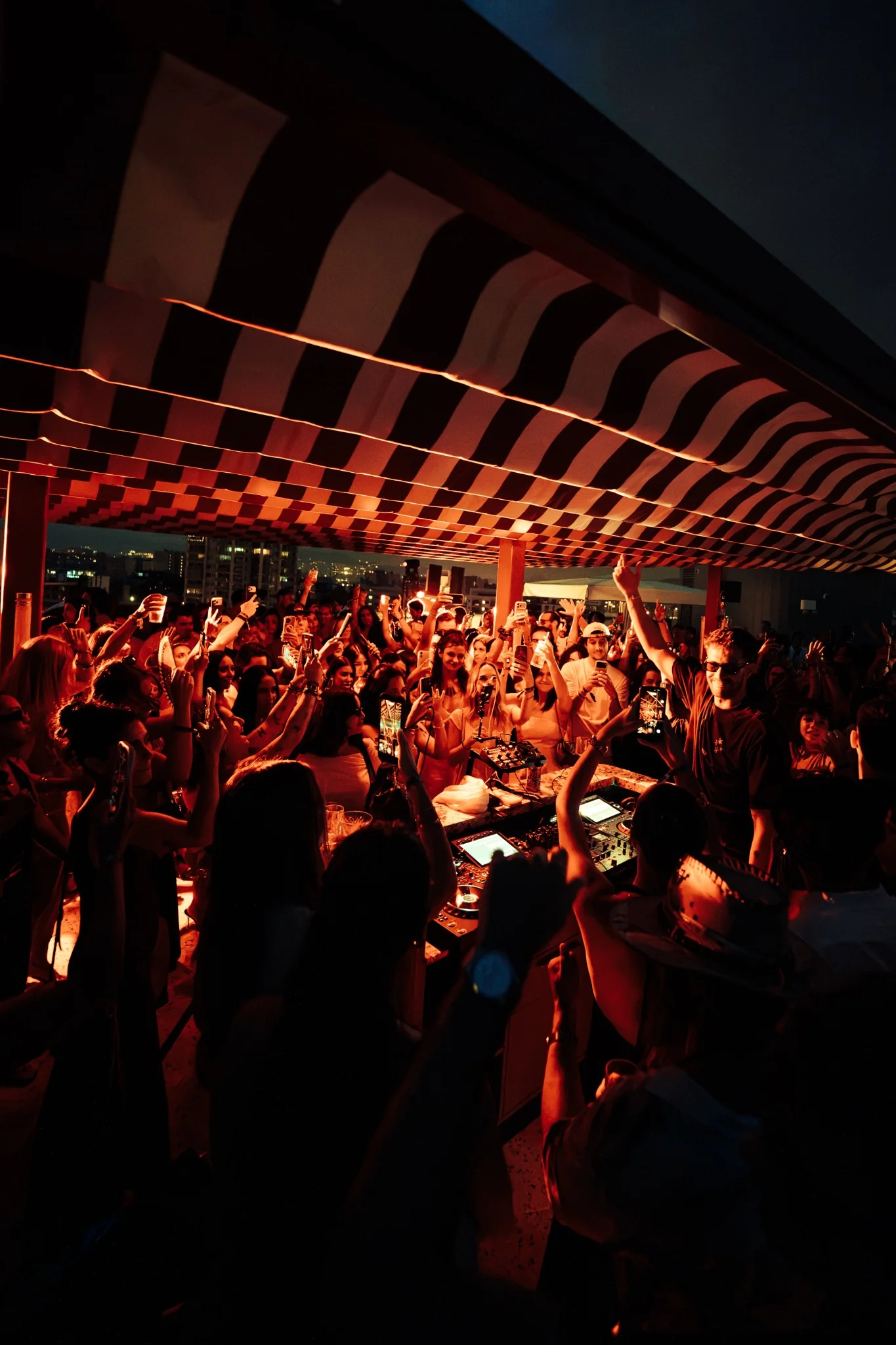 LXBE performing for a rooftop crowd